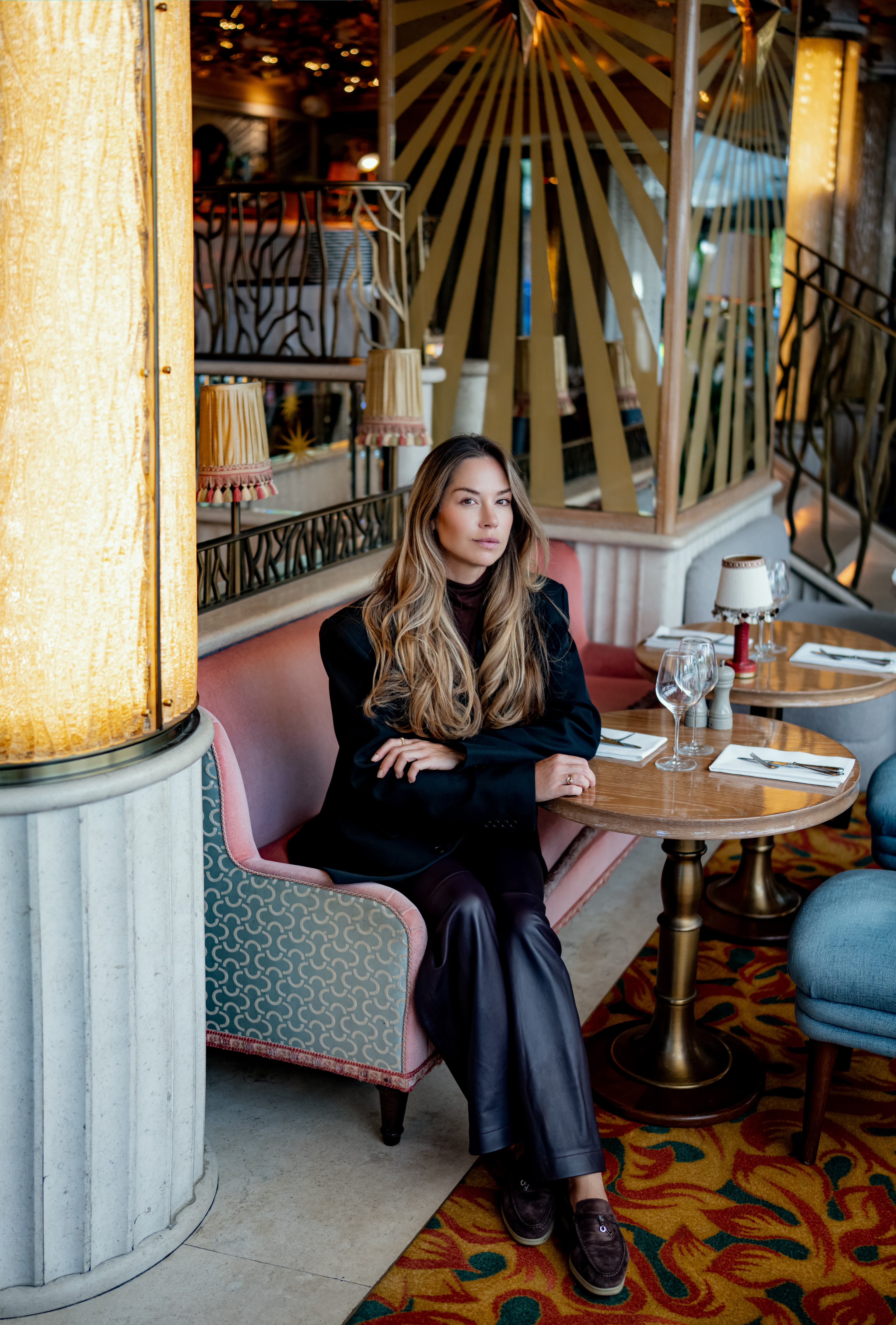 Aleksandra, founder of Domino Agency, in a hospitality interior